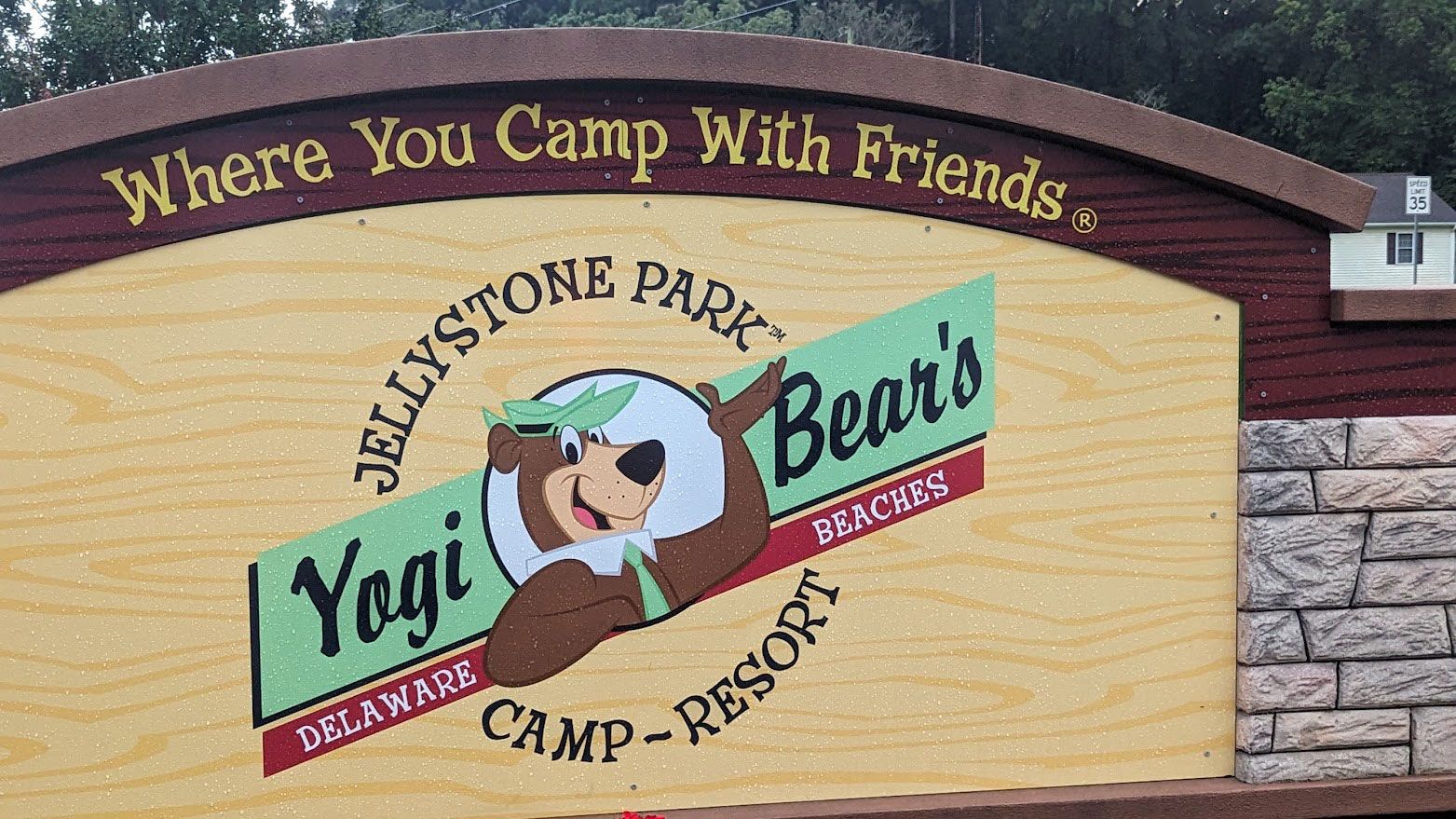A sign for Yogi Bear’s Jellystone Park Camp-Resort in Delaware featuring an illustration of Yogi Bear.