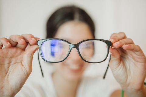 Female Holding an Eye Glasses — Campbelltown, AU — The Optical Shop