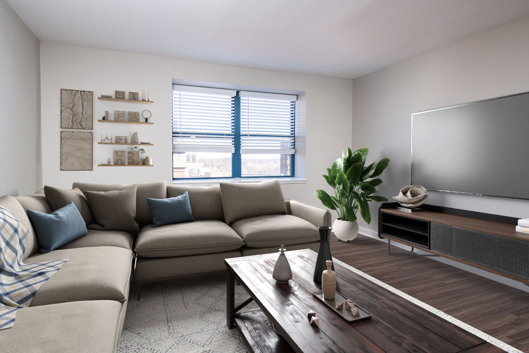 Living room with sectional sofa, TV, window, coffee table, and plant.