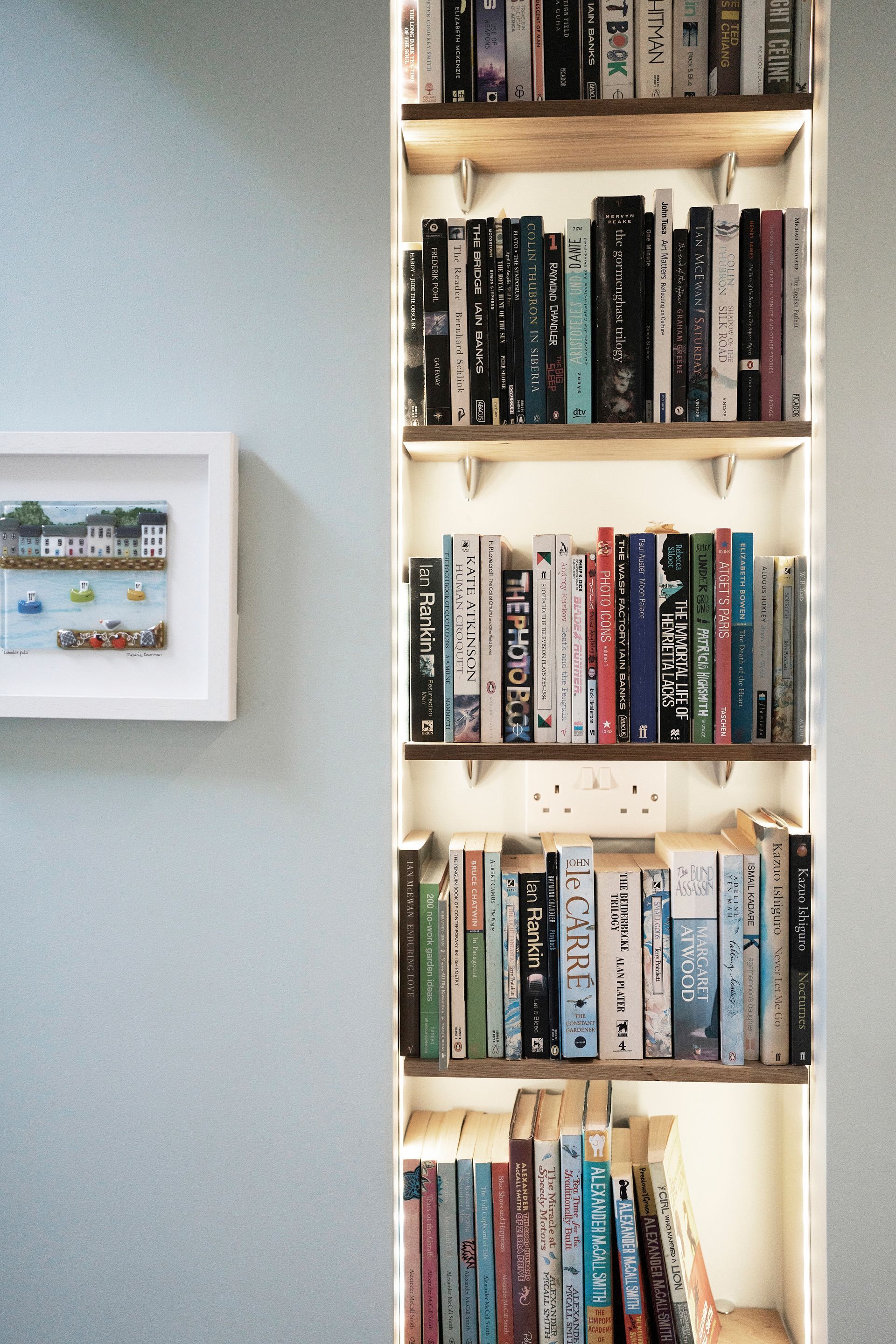 A living room with two couches , a coffee table , and a picture on the wall in a Construction Management in East Sussex