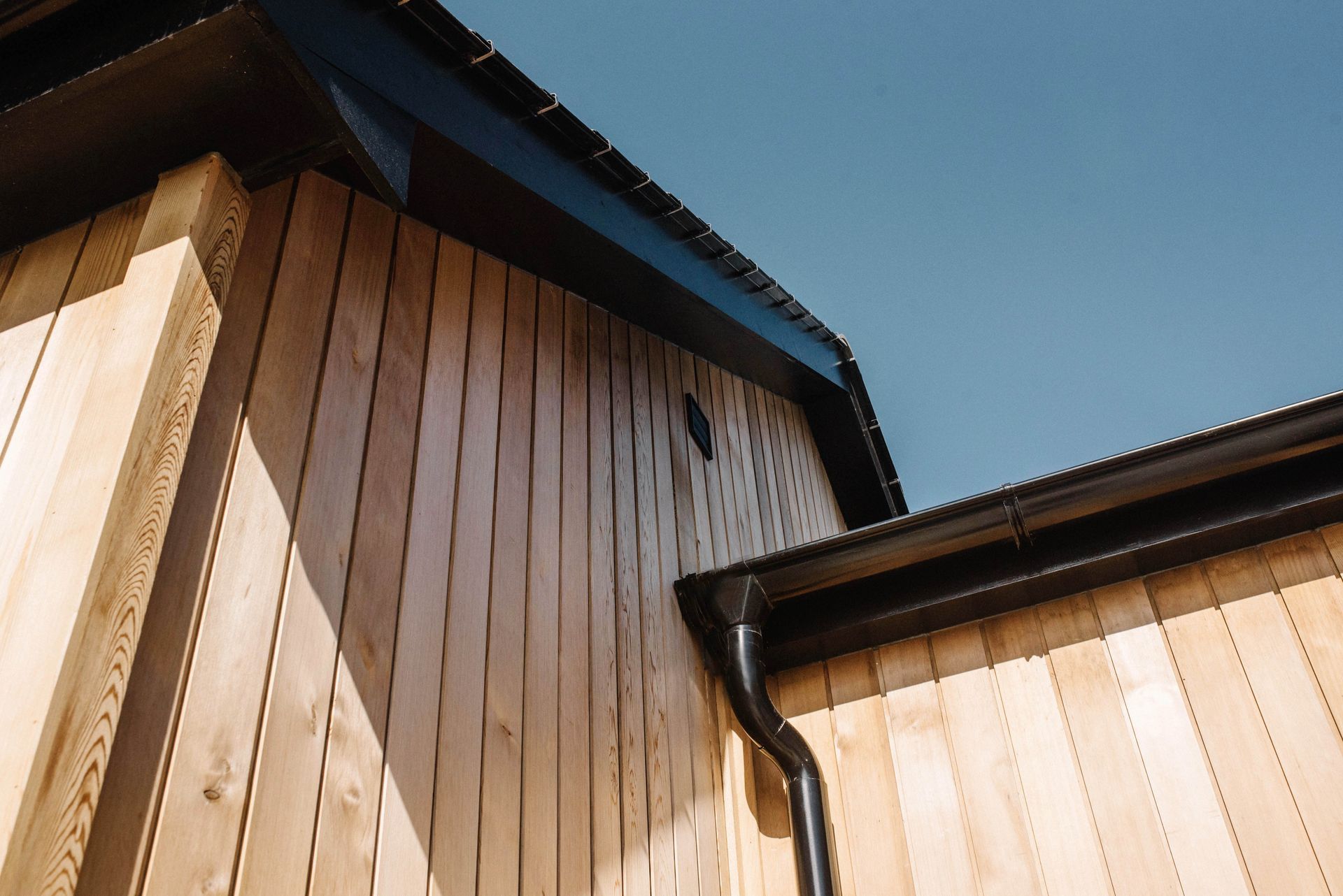 There is a chair with a green pillow on it in a room in a Retrofit Consultancy in East Sussex