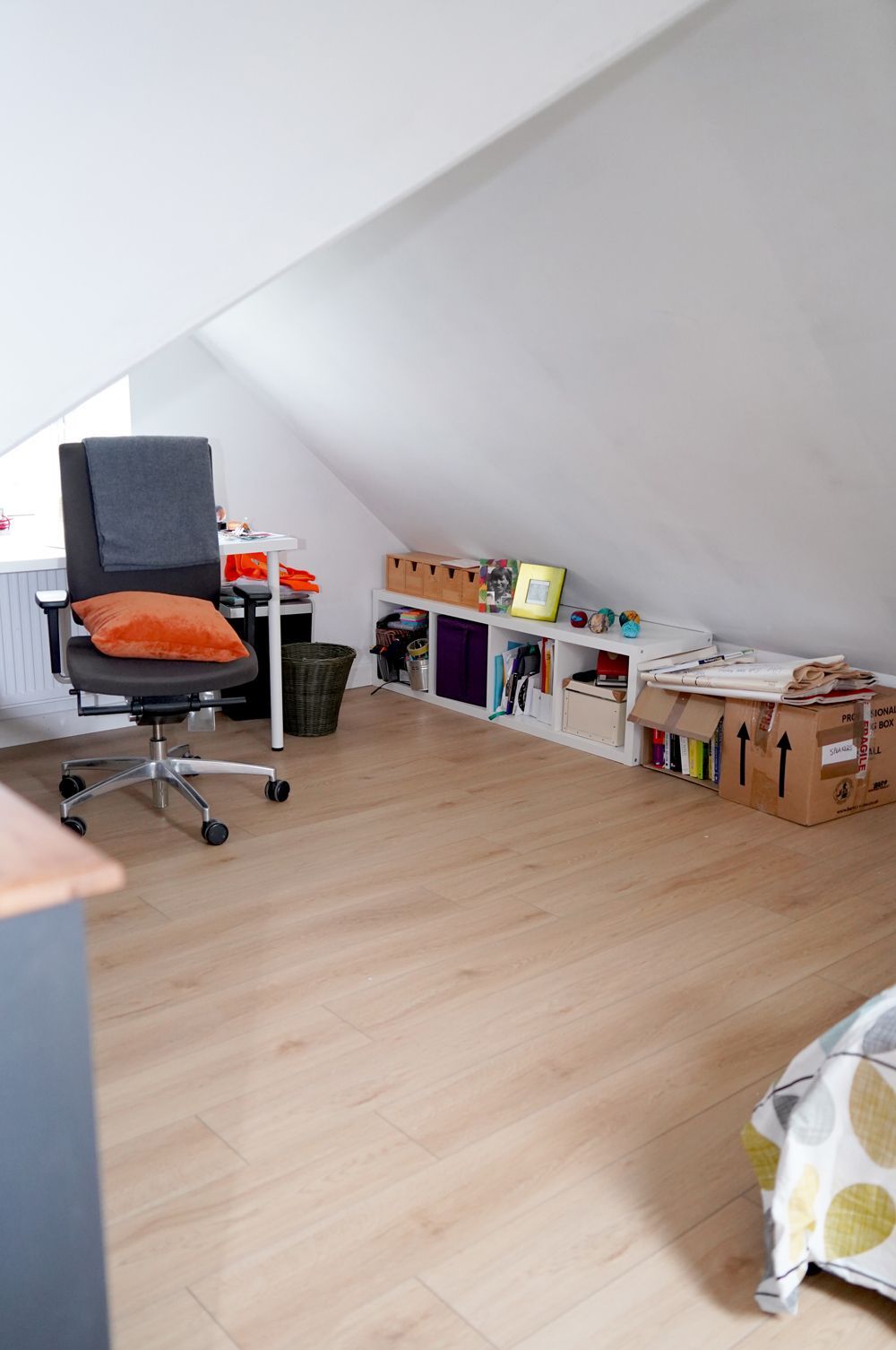A room with a desk , chair and boxes on the floor   in a Passivhaus New Builds in East Sussex