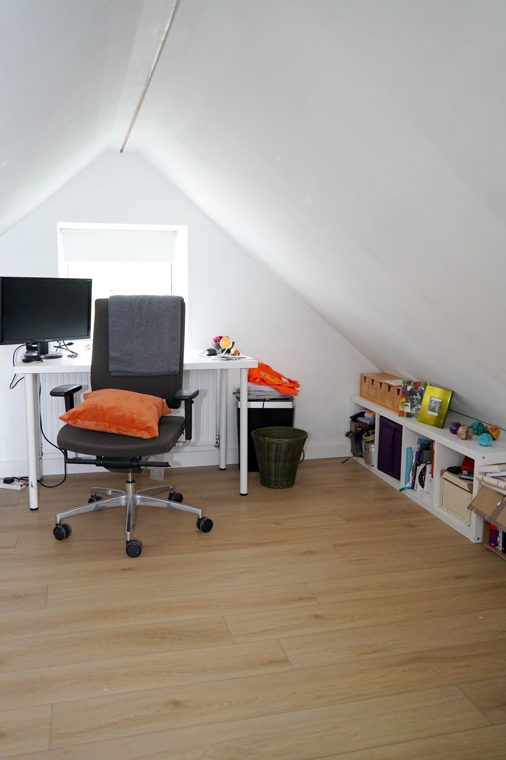 A room with a chair and a desk with a computer on it  in a Passivhaus New Builds in East Sussex