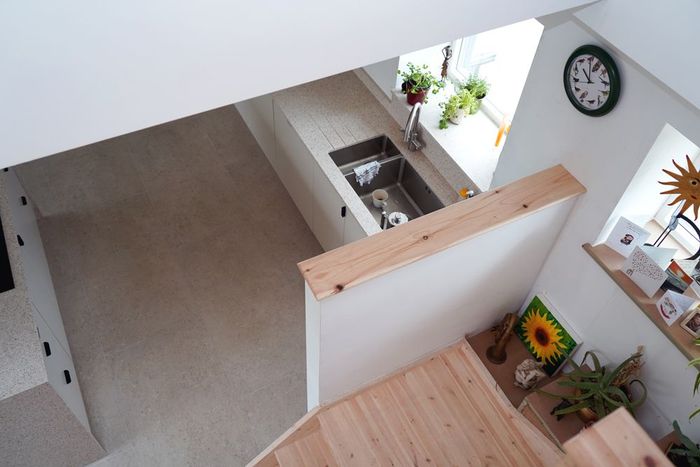 A kitchen with a sink and a clock on the wall in a Retrofit Consultancy in Hastings