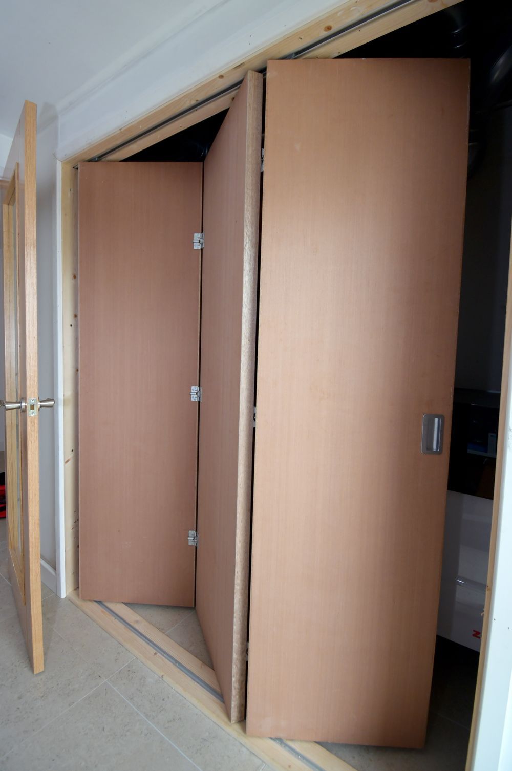 A room with a lot of doors that are open  in a Passivhaus New Builds in East Sussex
