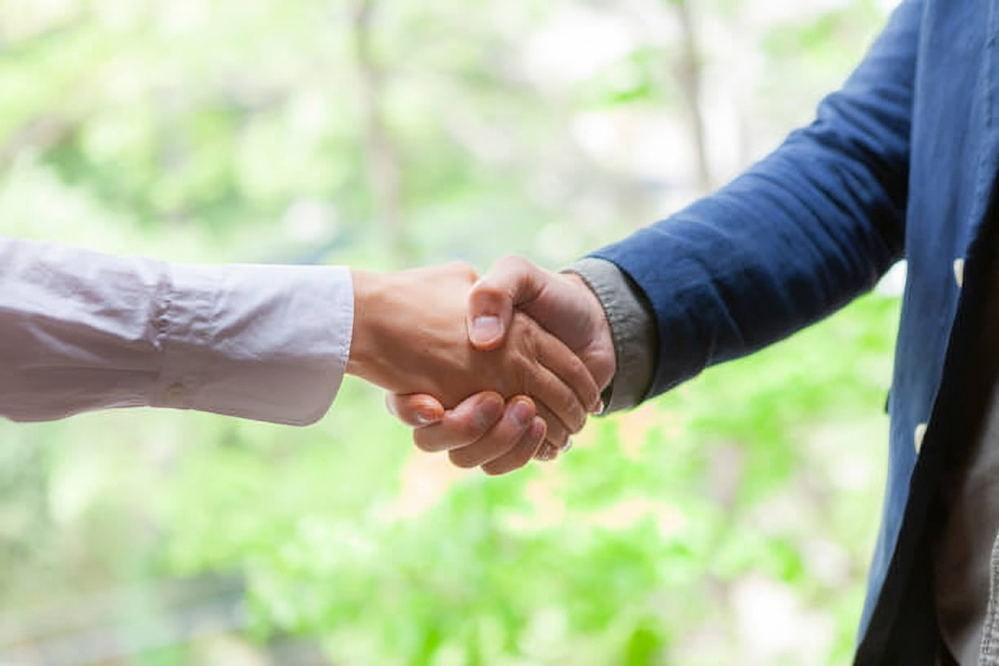 Two Men Are Shaking Hands — Marlboro, NY — Safety 360