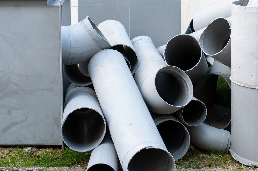 Stack Of Removed Pipes After Demolition — Efficient Waste Disposal in Gracemere, QLD