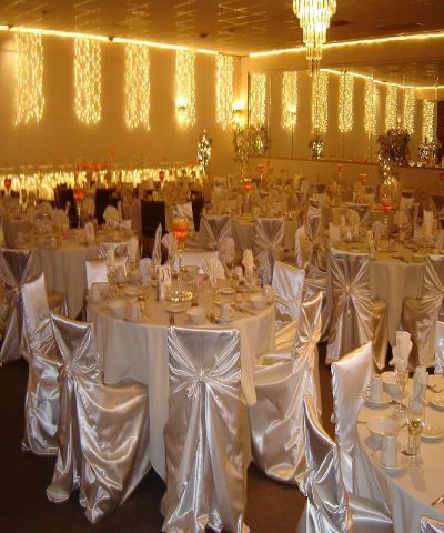 White Tables And Glass Candle Center Piece