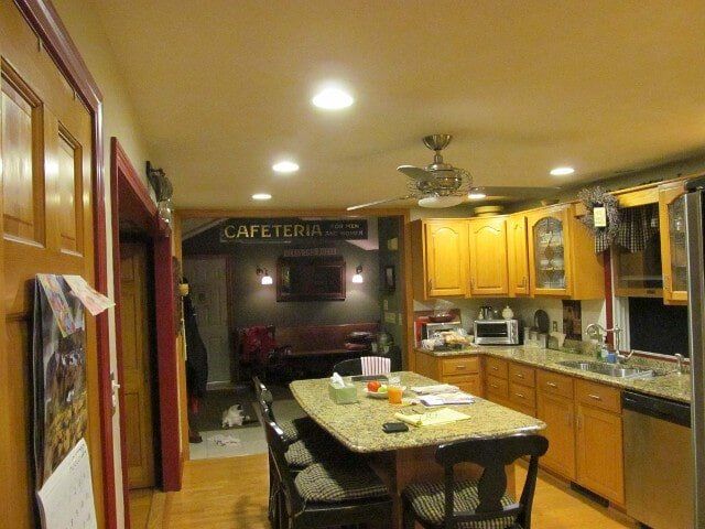 A kitchen with a sign that says cafeteria on it