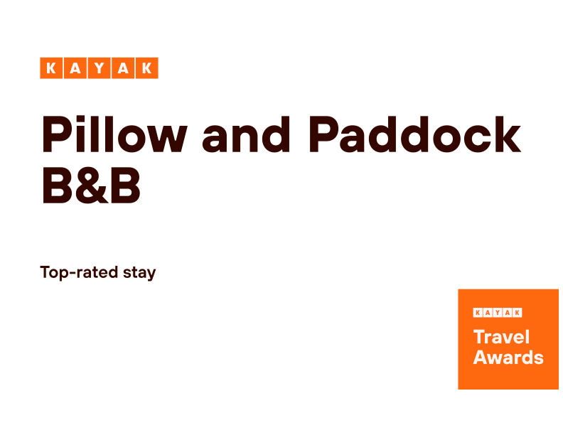 A white poster with the words KAYAK TOP-RATED stay for pillow and paddock b & b on it.