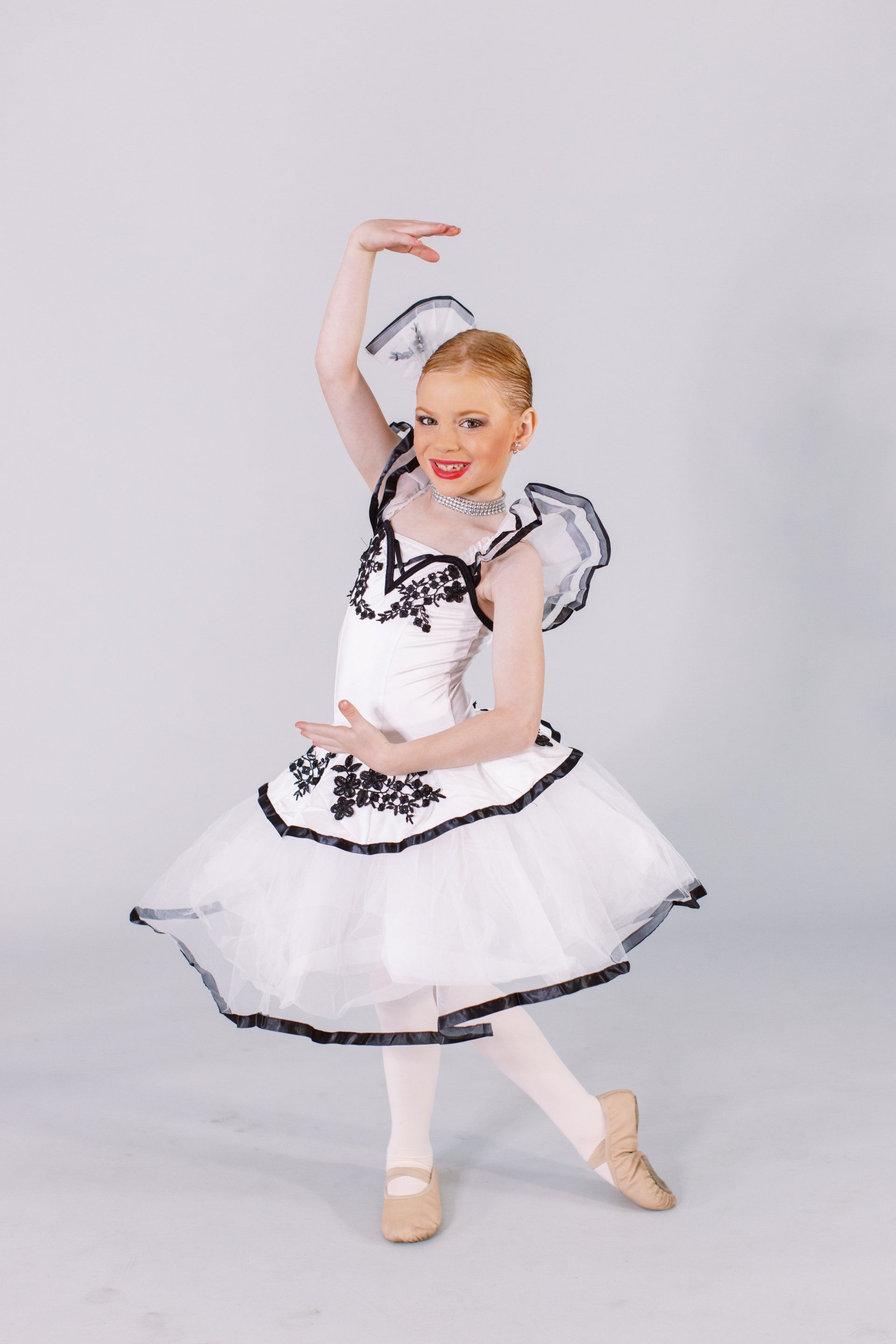 Little girl showing her ballet dance pose