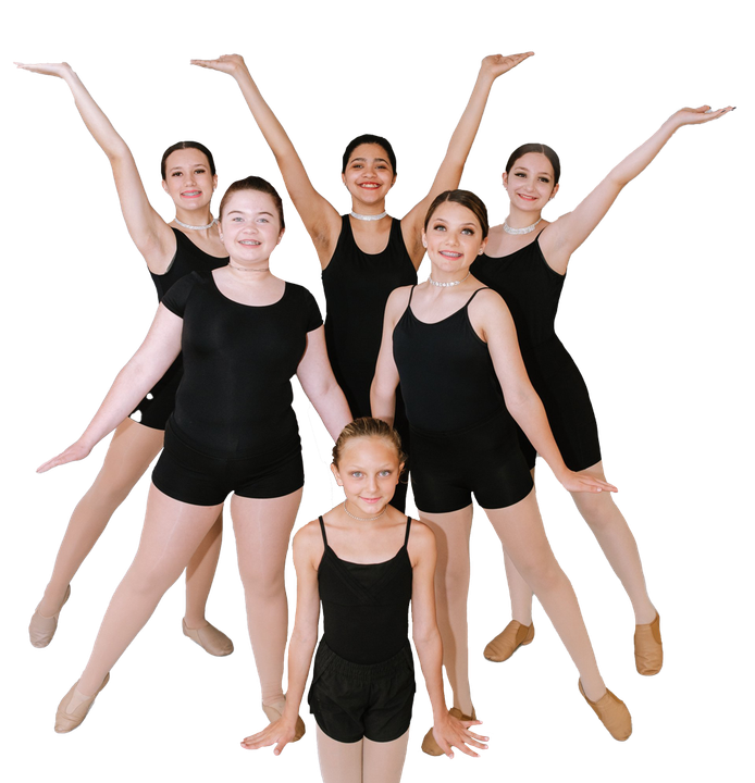 A group of young girls are posing for a picture with their arms in the air