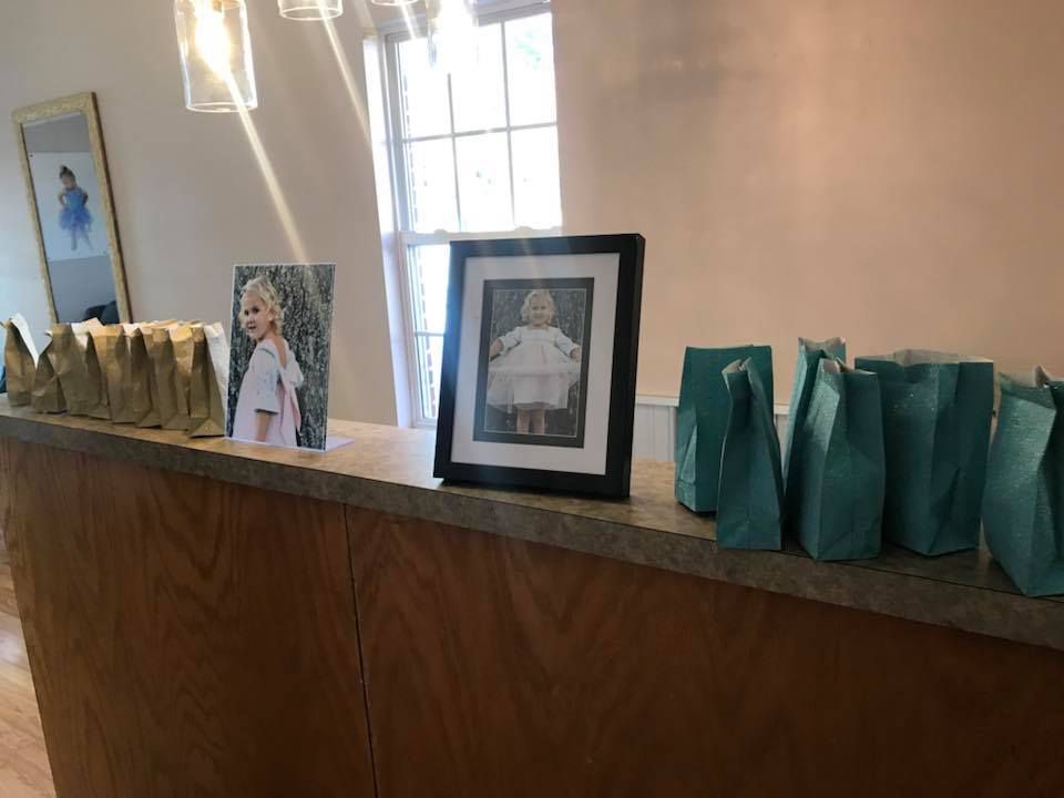 A wooden counter with a picture of a little girl on it.