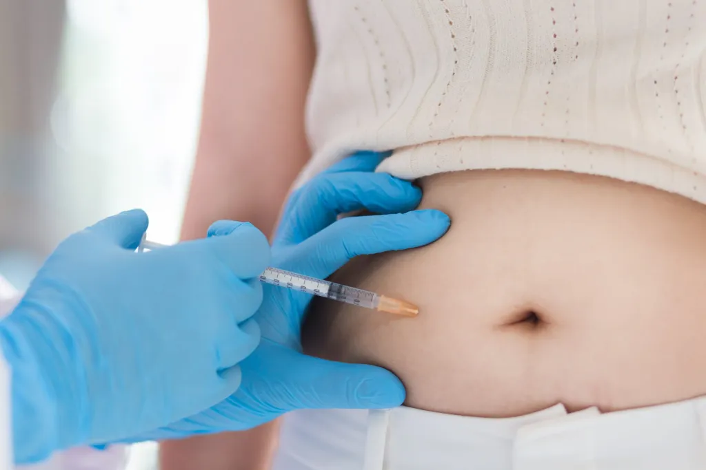 Person getting Semaglutide injected into their belly