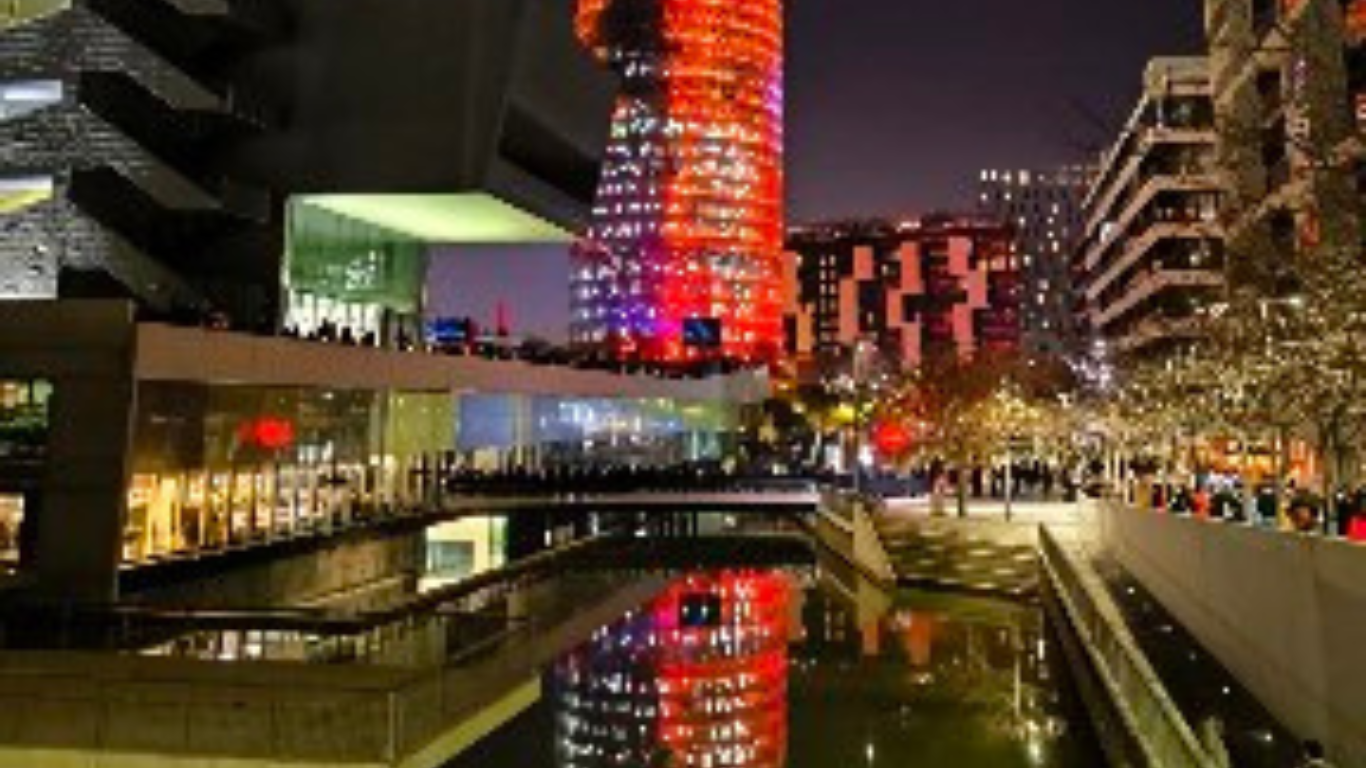 The illuminated Torre Glòries during the Arts Lights Festival in Barcelona