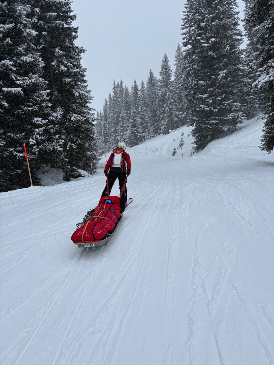 Jennifer in a red medical evacuation bag