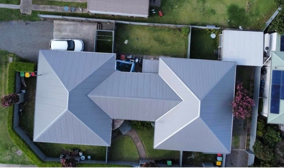 Overhead View of a House With a Gray Roof and a Car Parked in the Driveway — Your Craftsmen in Eleebana, NSW
