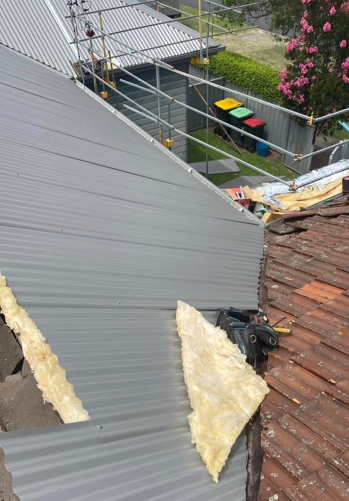 Partial View of a Roof Being Replaced With Corrugated Metal Sheeting — Your Craftsmen in Wallsend, NSW