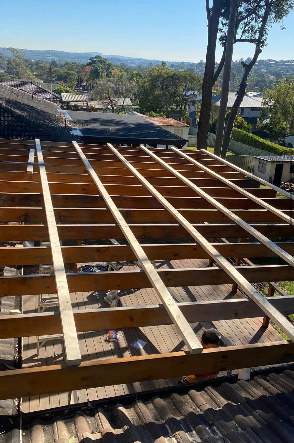 Wooden Deck Frame Under Construction on a Rooftop With a Sunny, Outdoor View — Your Craftsmen in Eleebana, NSW