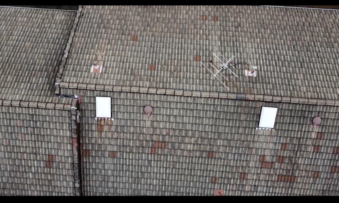 Overhead View of a Weathered Shingled Roof With a Small Antenna and White Vent — Your Craftsmen in Eleebana, NSW