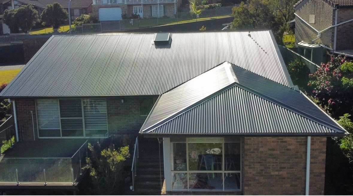 House With Corrugated Metal Roof in a Residential Setting — Your Craftsmen in Eleebana, NSW