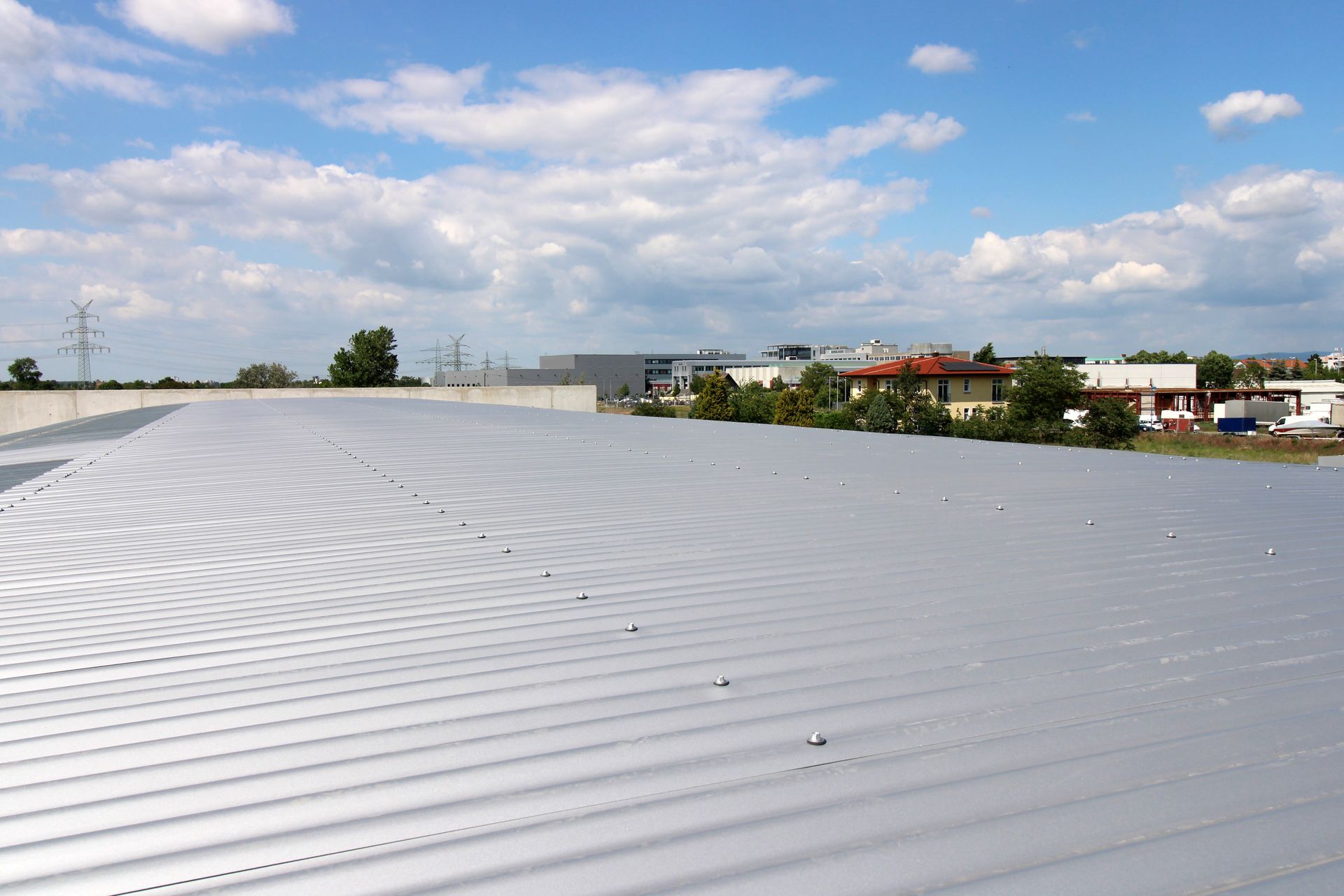A roof with a blue sky in the background