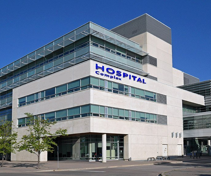 A large white building with the word hospital on it