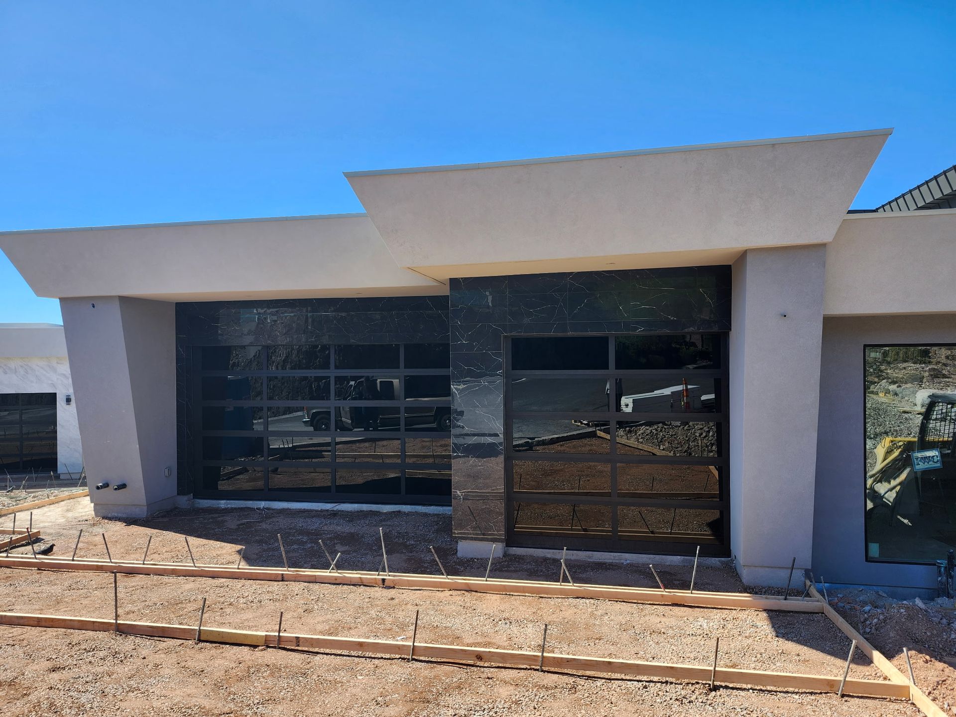 A house that is being built with a large garage door