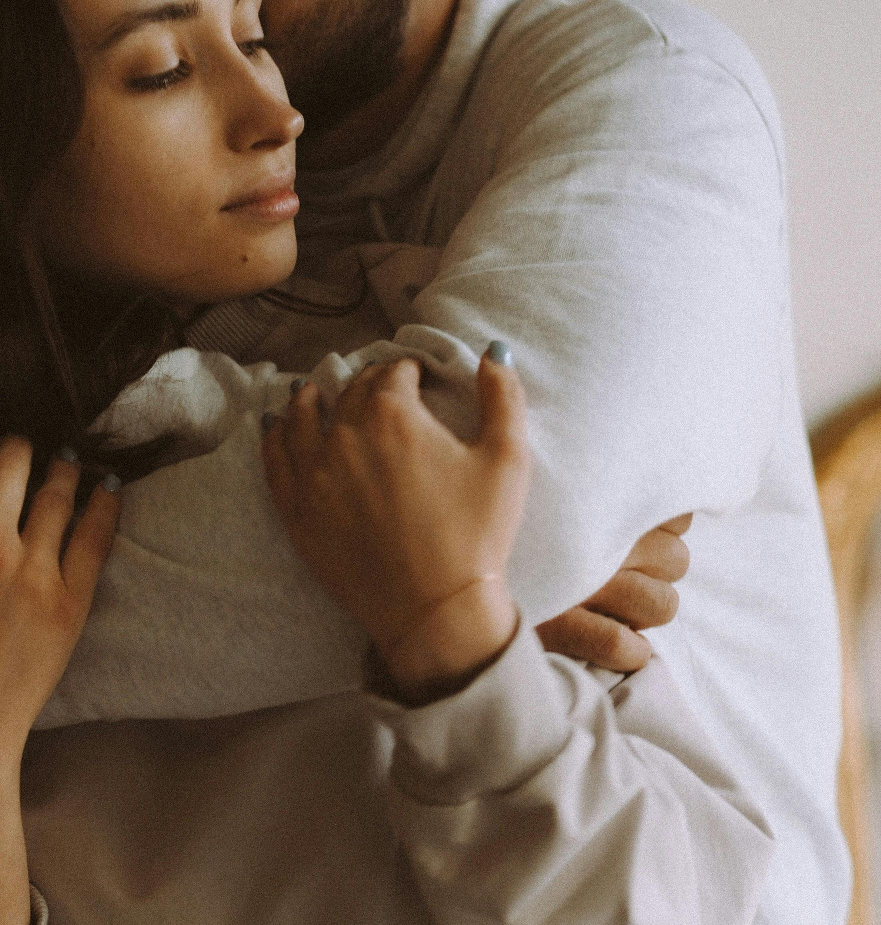 A bunch of potted plants are sitting on a window sill.