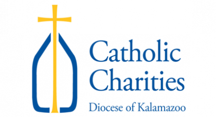 A logo for catholic charities celebrating 50 years of service