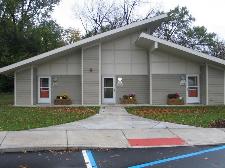 A small house with a walkway leading to it