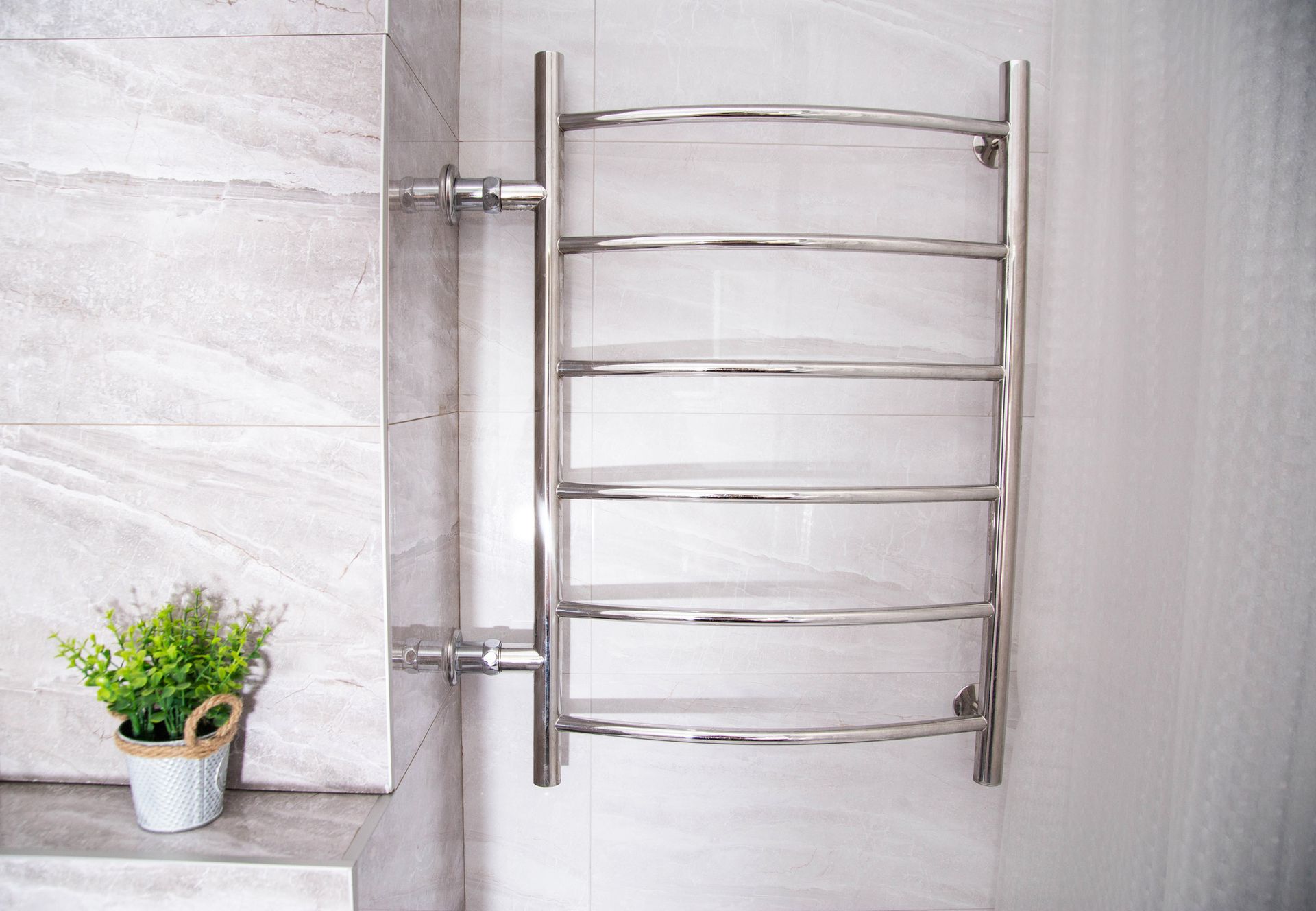 Hydronic heated towel rail in bathroom
