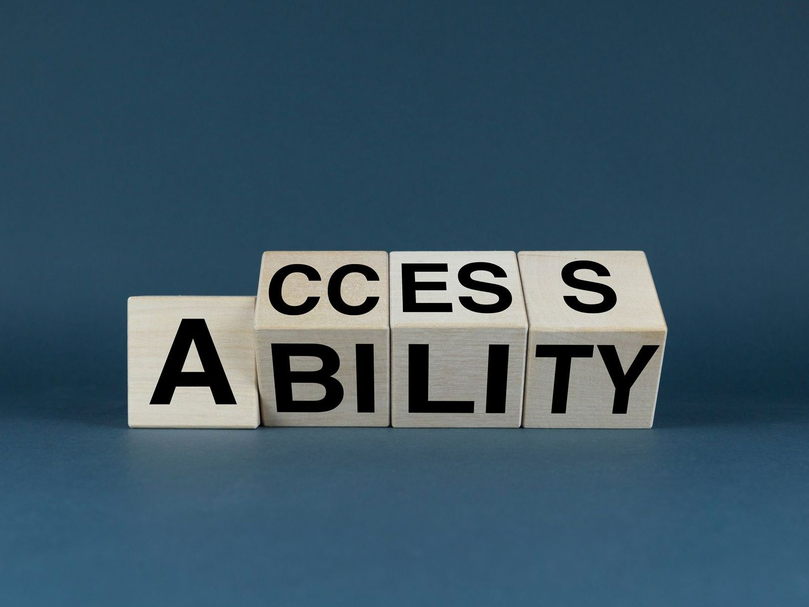 The word ability is written on blocks on a blue background