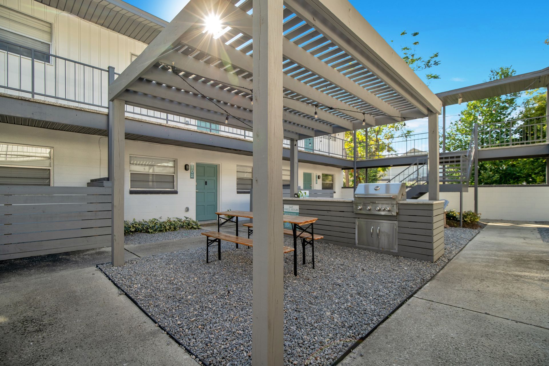 An aerial view of a city with lots of buildings and trees.
