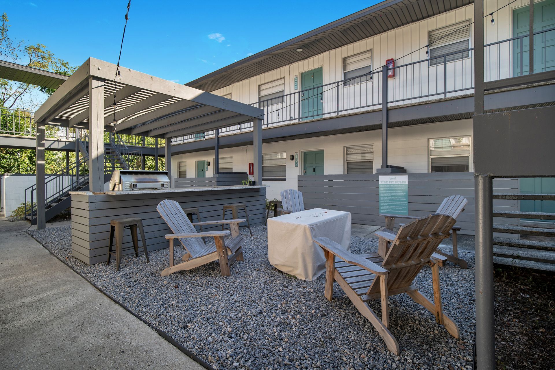 A group of chairs are sitting in front of a building.