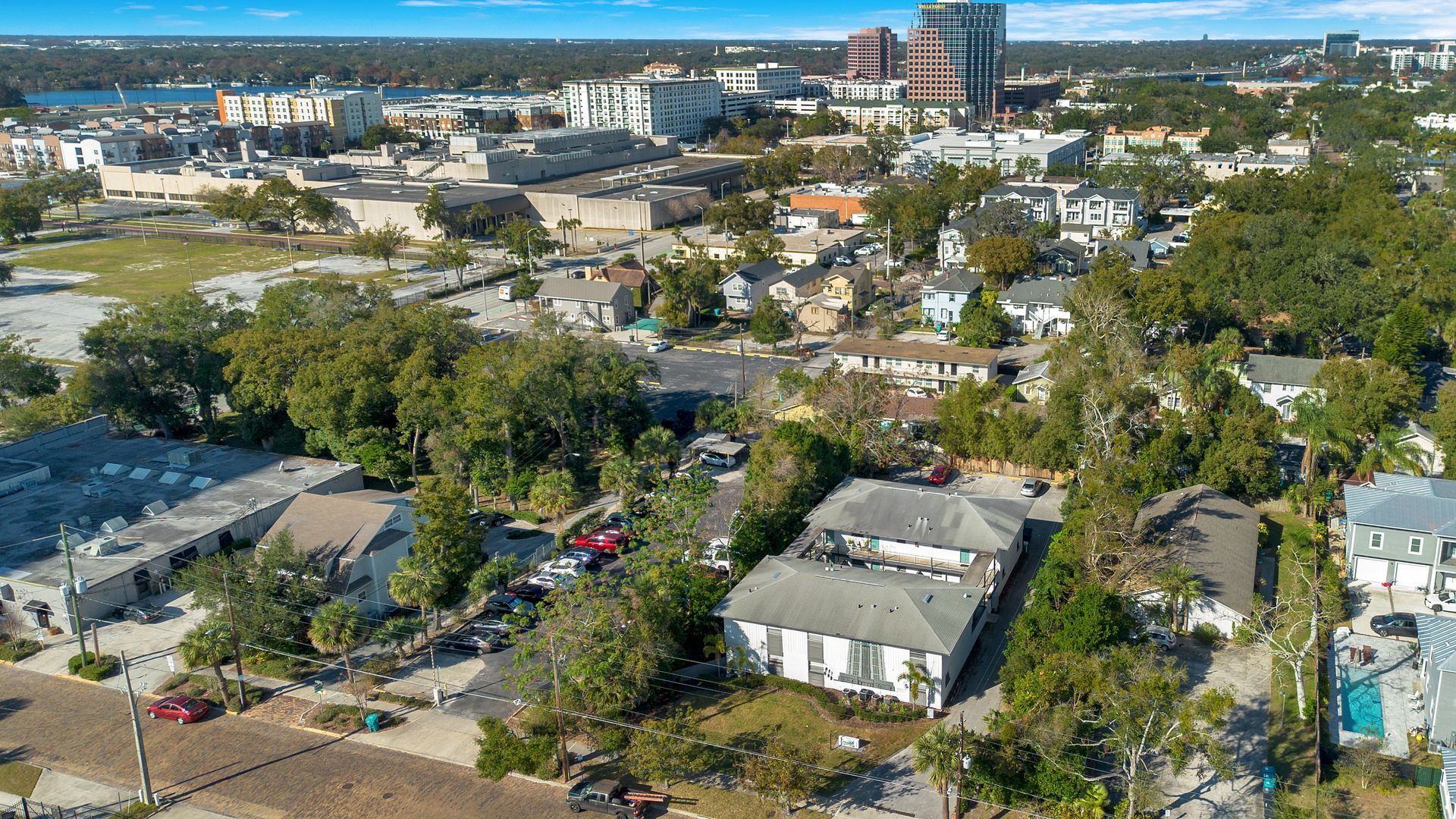 An aerial view of a city with lots of buildings and trees.