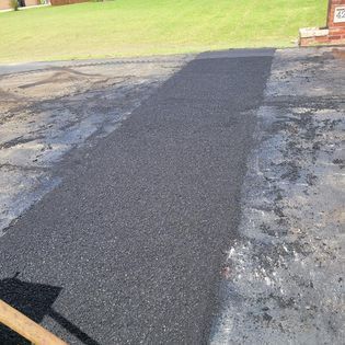 A Wet Road with Grass on the Side — Midwest City, OK — MPSC