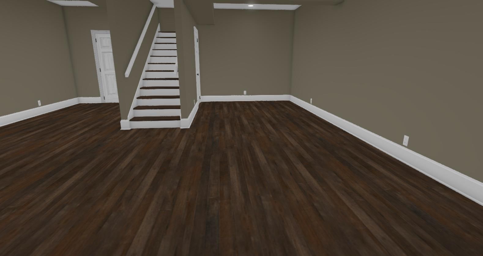 An empty room with hardwood floors and stairs.