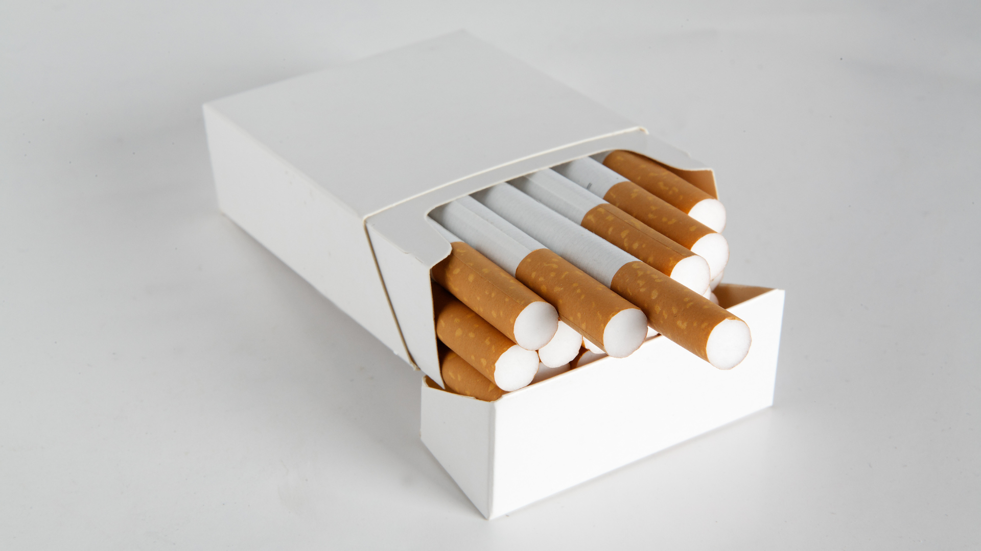 A box of cigarettes is sitting on a table