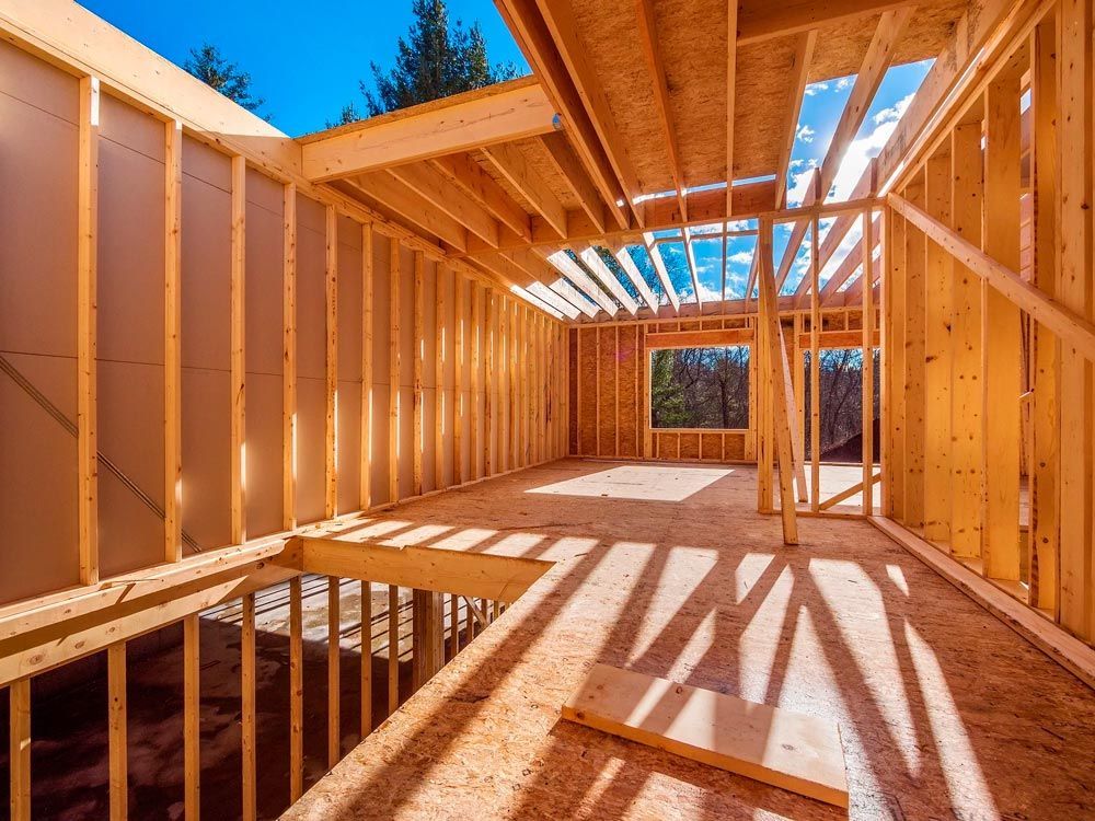 A house is being built with wooden beams.