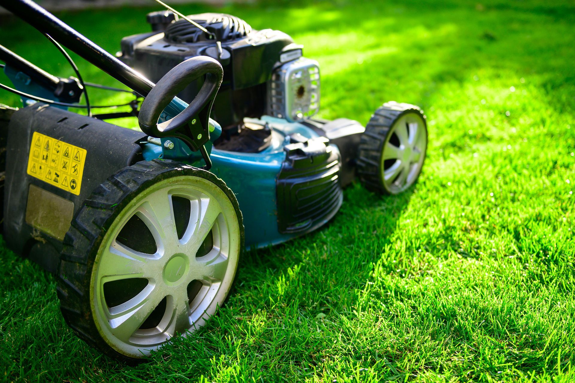 Green Mowing Machine — Charlotte, NC — Battery Service & Supply Company