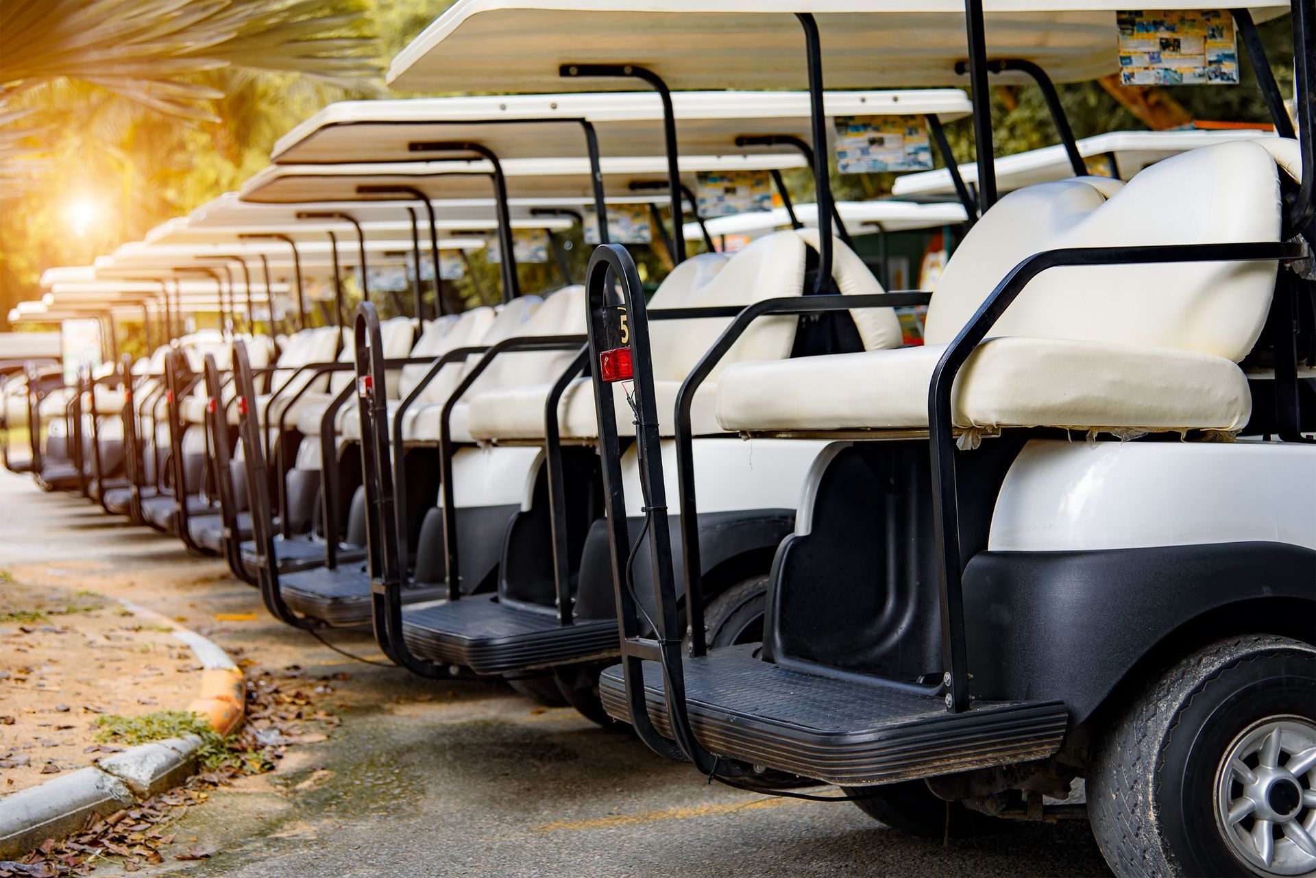 White Golf Carts in a Row — Charlotte, NC — Battery Service & Supply Company