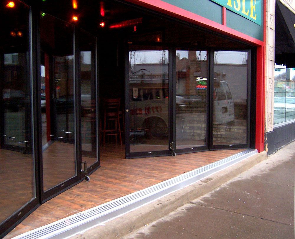A store front with sliding glass doors and a sign that says ' able ' on it