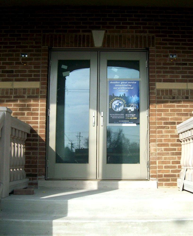 A brick building with a poster on the door