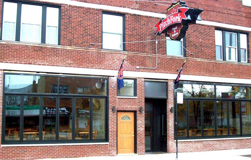 A brick building with a sign that says market on it
