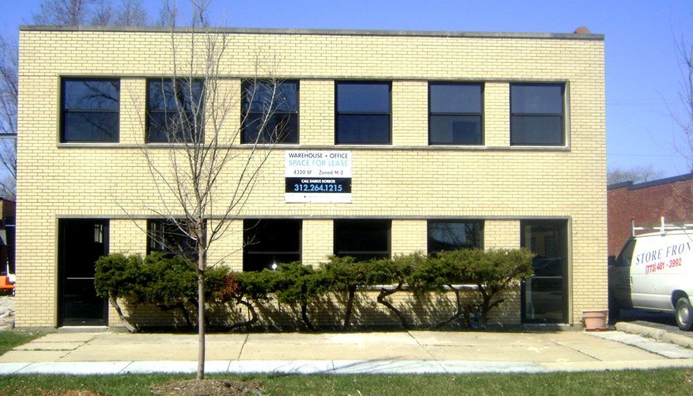 A large brick building with a sign on it that says truth