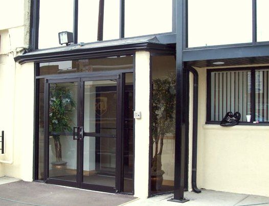 A building with a large glass door and a window