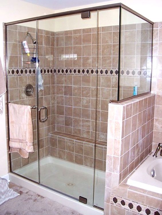 A bathroom with a sliding glass shower door