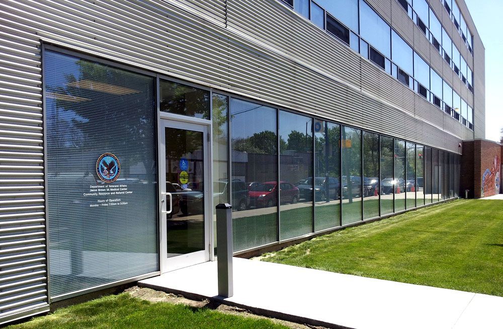 A large building with a lot of windows and a door