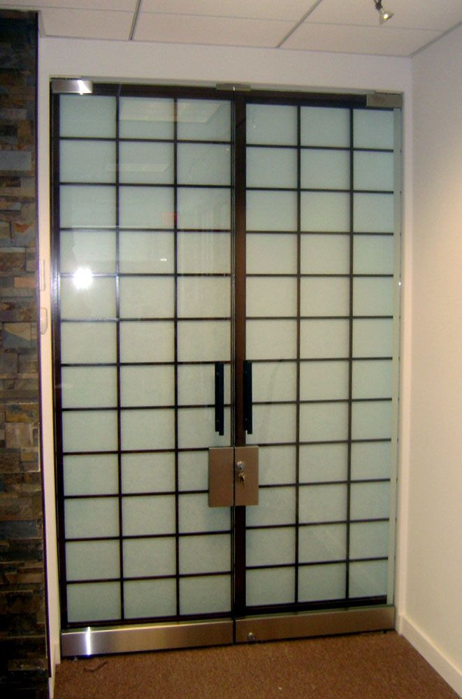 A pair of sliding glass doors with squares on them
